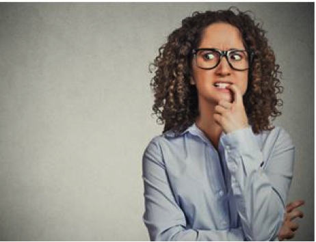 Women biting finger looking nervous